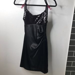 Sleek black dress with sequined bust